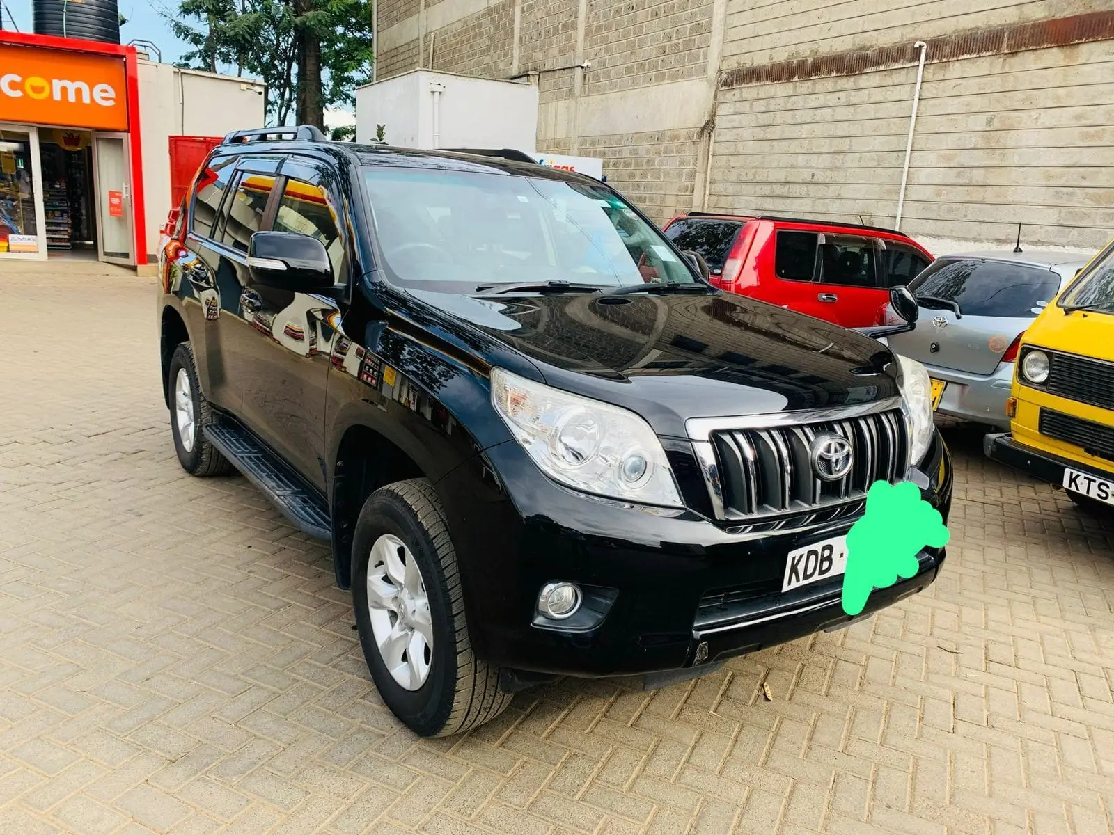 Black classic-shape Toyota Land Cruiser Prado photographed from the front