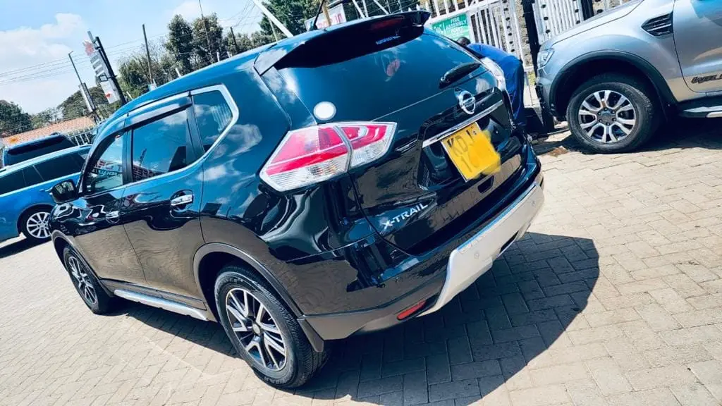 Dark Nissan X-Trail compact SUV photographed from the rear